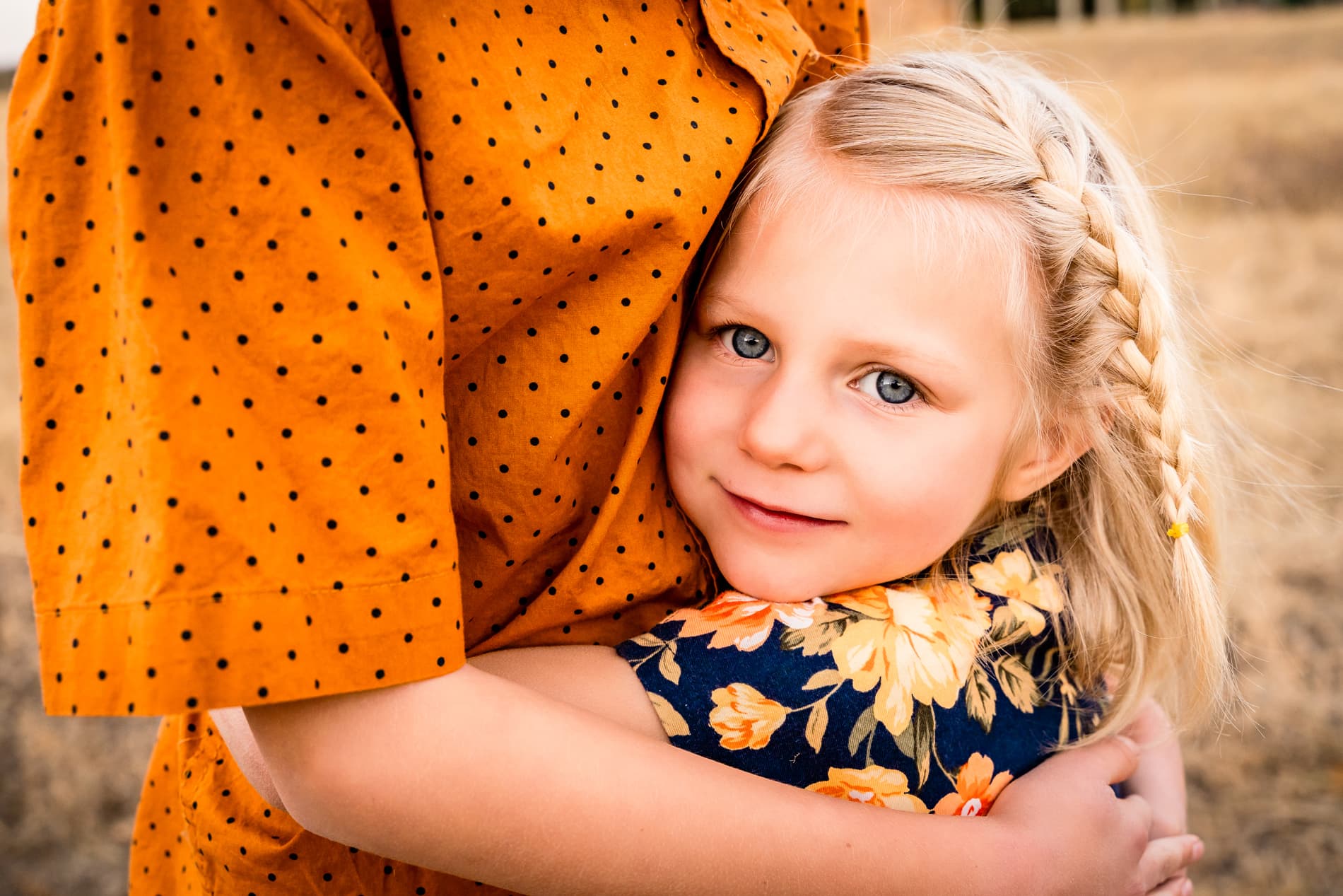 Family Photographer, little girl holds mom tight