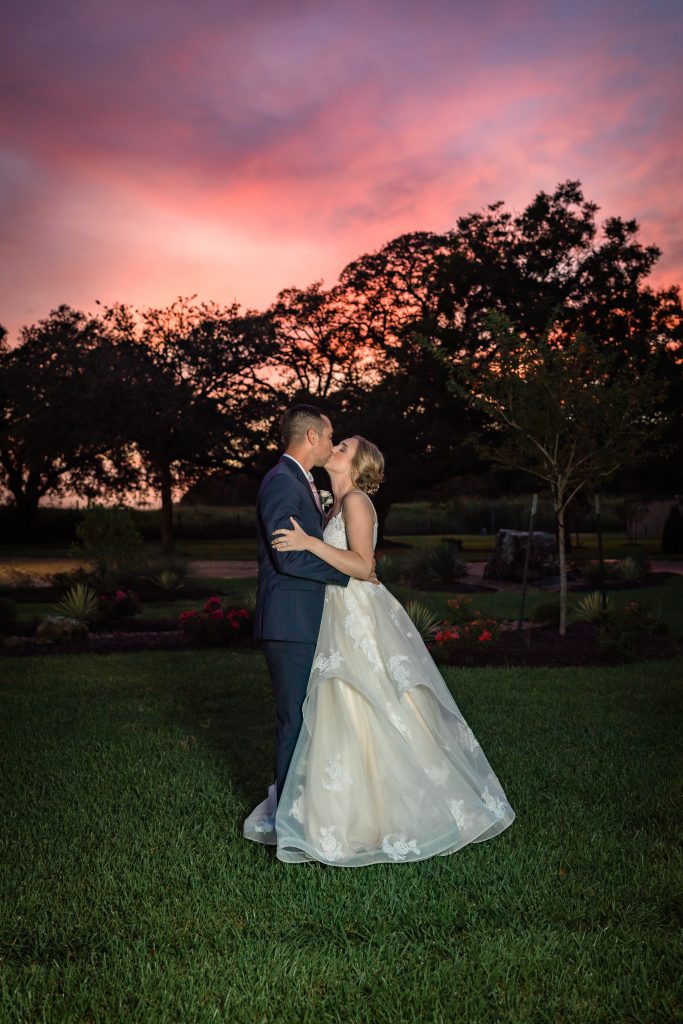 Bride and Groom at sunset in texas wedding venue Hidden Oaks