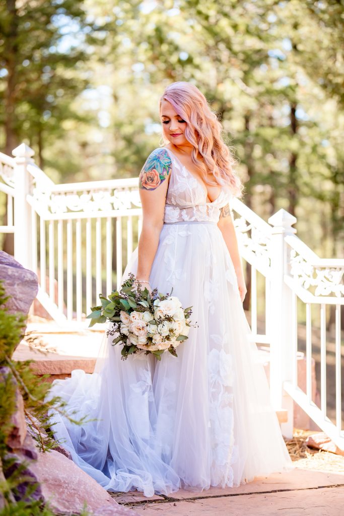 Wedding Photographer, bride holds her bouquet before wedding