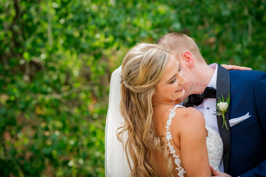 Wedding Photographer, Bride and groom kiss outdoors