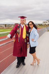 two people standing at graduation
