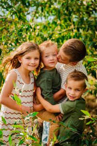 children smiling for photograph in colorado